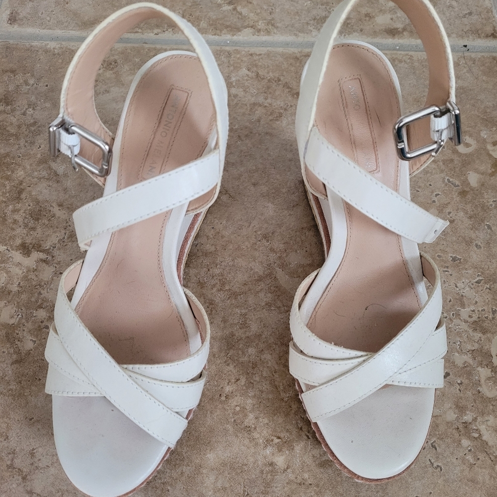 Wedge sandals. White to cream color.